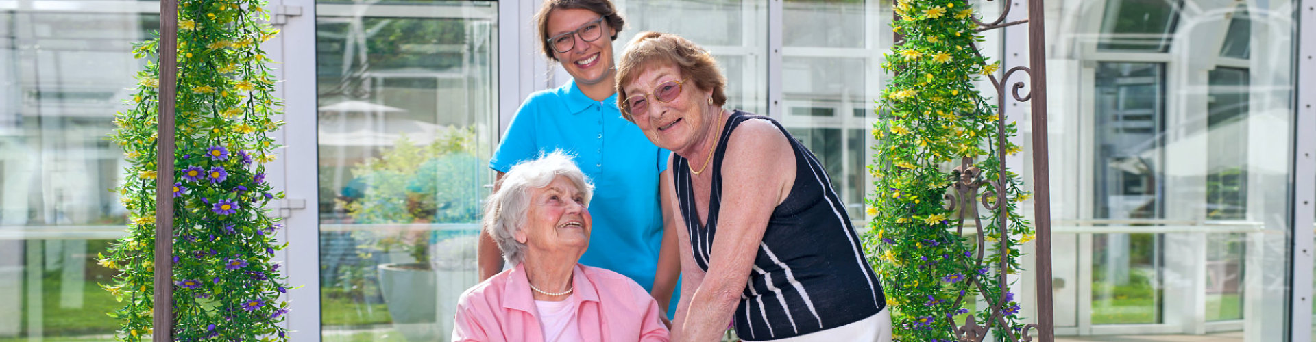 woman seniors and caregiver smiling