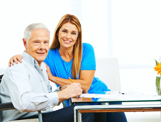 a happy elderly man with her caregiver