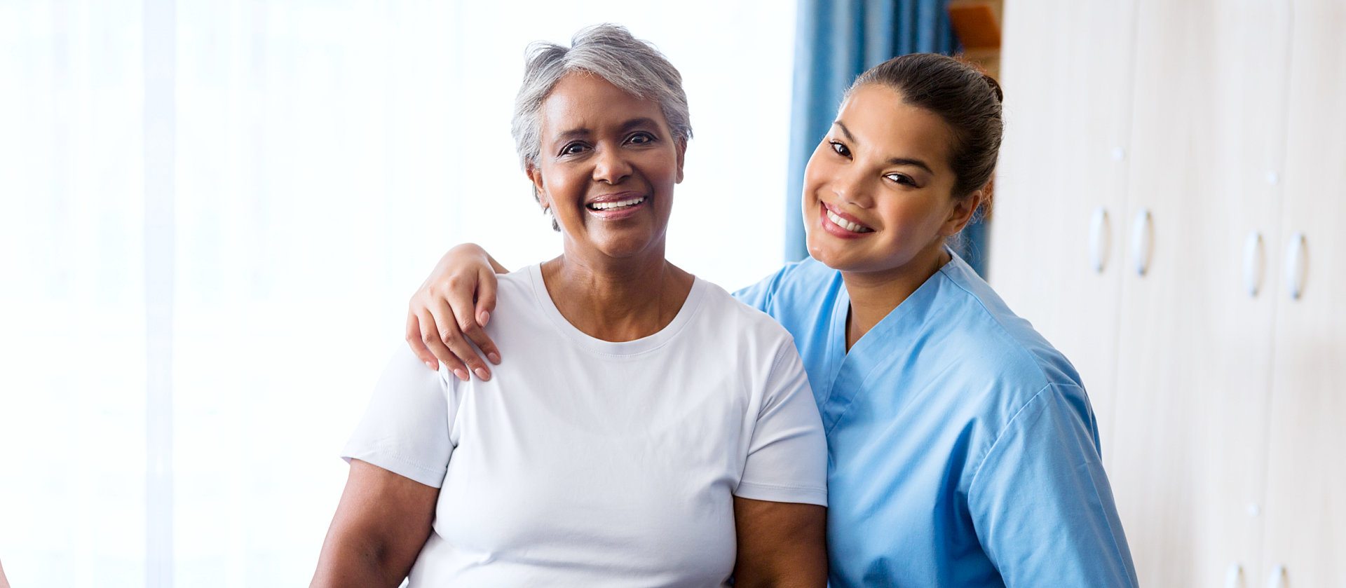 a photo of a senior woman with her caregiver
