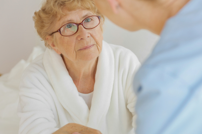 senior woman looking on the caregiver