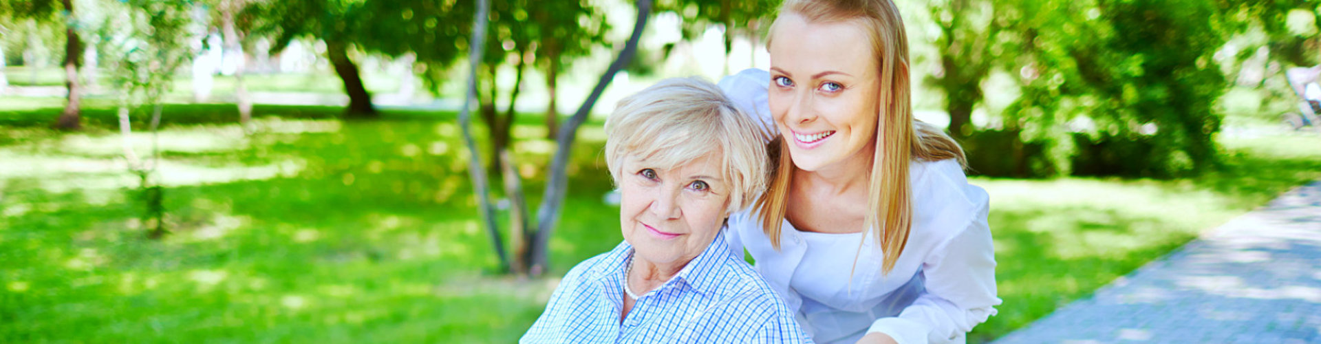 caregiver and senior woman smiling