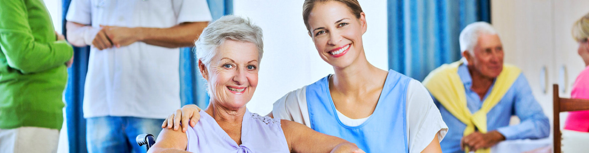 caregiver and senior woman smiling